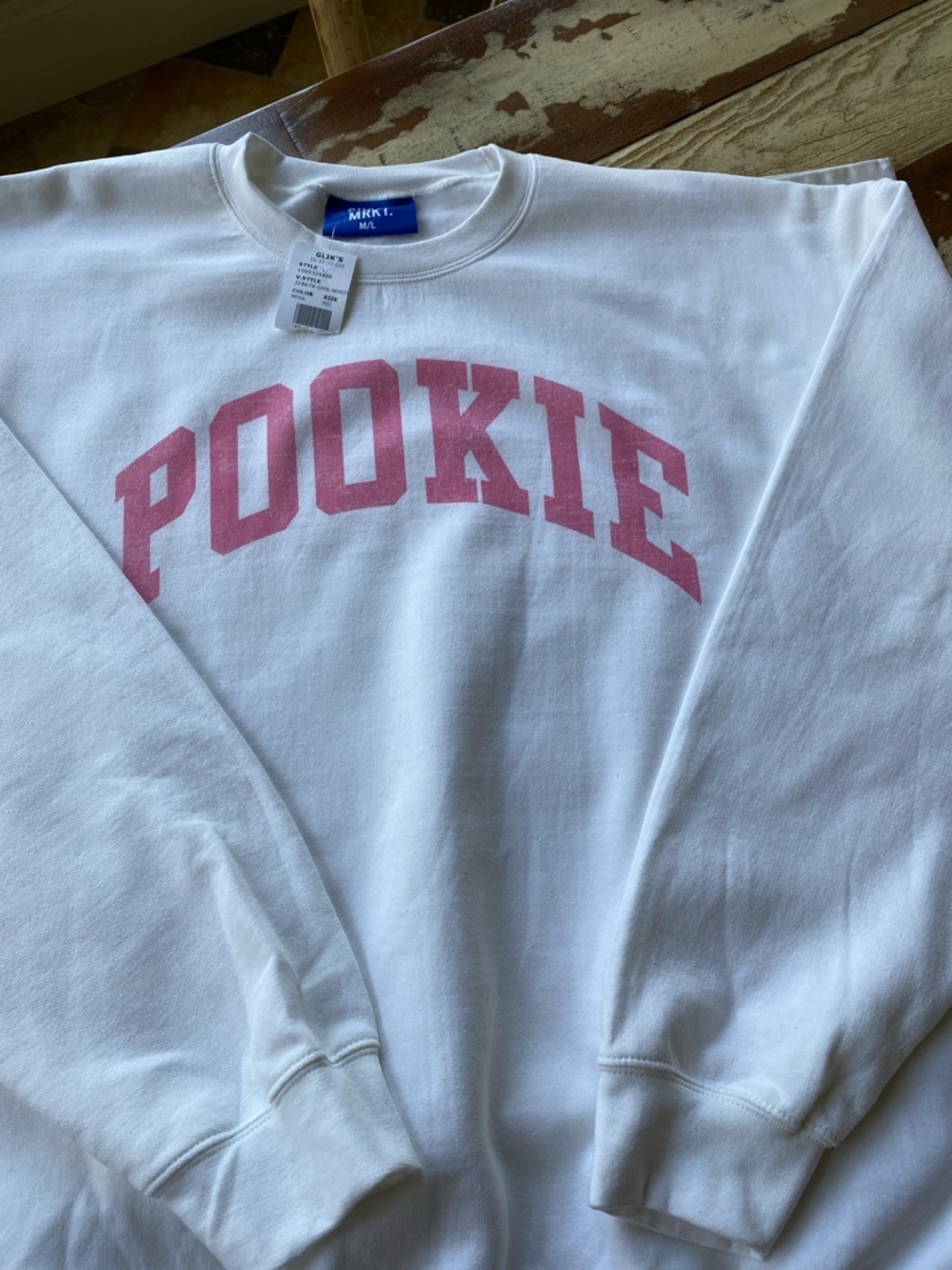 White Oversized Crewneck Sweatshirt with Pink 'POOKIE' Arch Logo from SUPER MRKT